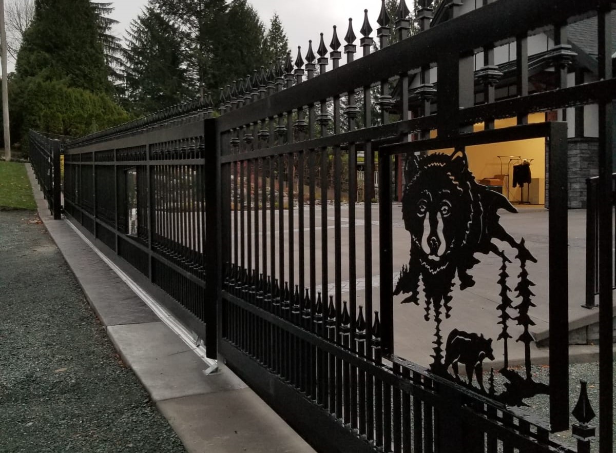 Ornamental Gate with vertical picket design and waterjet cut bear image fabricated within the gate